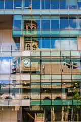 Reflection of Adelaide Town Hall in a glass facade of a high-rise building, Adelaide, South Australia