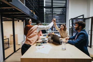 Business team working late, analyzing stats, discussing strategies for business growth, ensuring project completion, driving sales, increasing productivity.