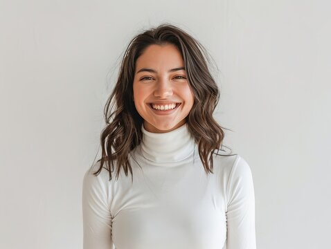 A smiling and cheerful women, exuding confidence and happiness with white turtleneck.