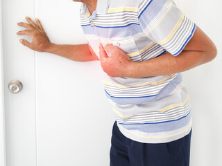 Asian man having severe chest pain as heart attack and illness concept on white background. closeup...