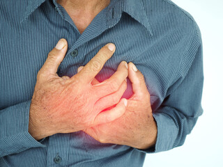 Asian man having severe chest pain as heart attack and illness concept on white background. closeup photo, blurred.