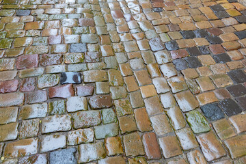 background of wet cobblestone street in historic pattern in Germany - 760946874