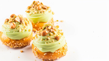 Obraz premium Choux cake with pistachio cream and nuts, French dessert on white background. Generative Ai