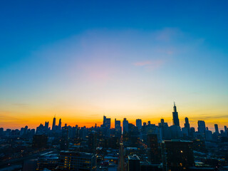 Cityscape Silhouette: A Dazzling Sunset Over the Urban Horizon As the sun gracefully descends, the...