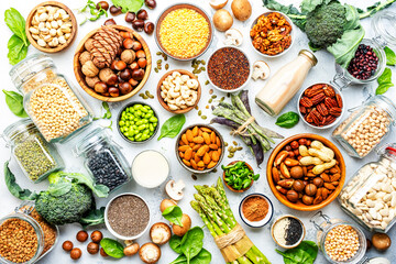 Vegan food background. Plant protein., vegetarian nutrition sources. Healthy eating, diet ingredients: legumes, beans, lentils, nuts, soy milk, tofu, cereals, seeds and sprouts. Top view - obrazy, fototapety, plakaty