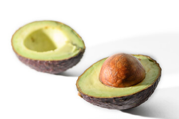 Avocado cut in half isolated on white background. Clipping path