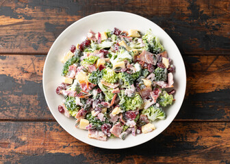 Healthy Homemade Broccoli Salad with bacon, red onion, cranberries, pumpkin seeds and cheese