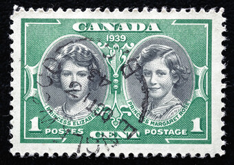 Ukraine, Kiyiv - February 3, 2024.Postage stamps from Canada.A stamp printed by Canada, shows Princess Elizabeth and Princess Margaret Rose, circa 1939