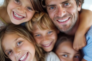 Fototapeta premium A joyful family moment, with a father and his children huddled together, smiling brightly, showcasing a strong bond and happiness.