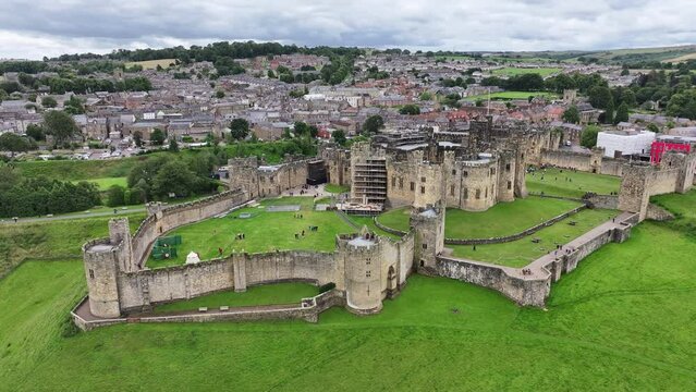 Drone Shot, Alnwick Medieval Castle Walls, Town and Green Landscape, England UK