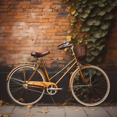 Deurstickers Vintage bicycle leaning against a brick wall.  © Cao