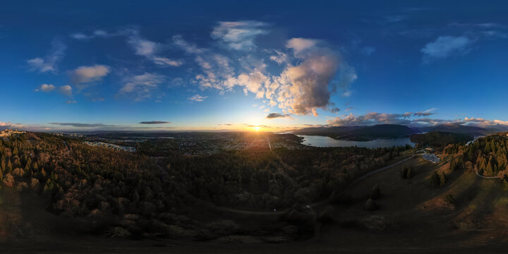 360 degree aerial view over the city during sunset. Burnaby, Vancouver, BC, Canada