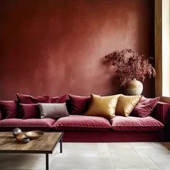 Poster Art deco interior design of modern living room, home. Crimson sofa with golden pillows against empty dark red venetian stucco wall with copy space. © Vadim Andrushchenko