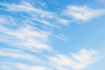 gentle cirrus clouds in a bright blue sky