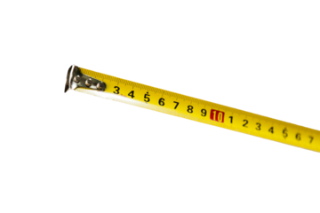 Yellow tape measure isolated on neutral background. Measurement concept. Masonry concept