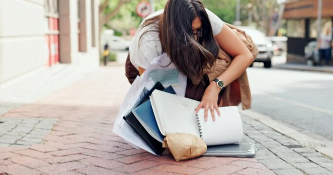 Document, fail and business woman in the city with multitasking and fall on the street. Late, paperwork and morning with drop and trip on a sidewalk with a female professional and stress from work