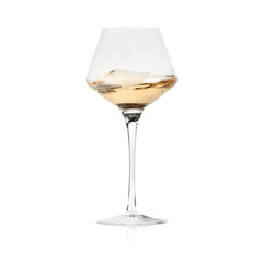 White wine splashing in glass on white background