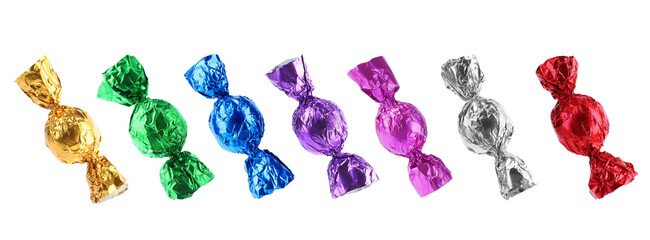 Tasty candies in bright wrappers isolated on white, set