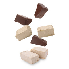 Pieces of tasty halva and chocolate falling on white background