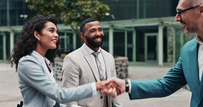 Handshake, corporate and business people in city for teamwork, agreement or partnership meeting. B2b networking, professional and men and woman shaking hands for greeting, onboarding and thank you