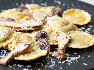 Ravioli pasta with mushrooms on a plate