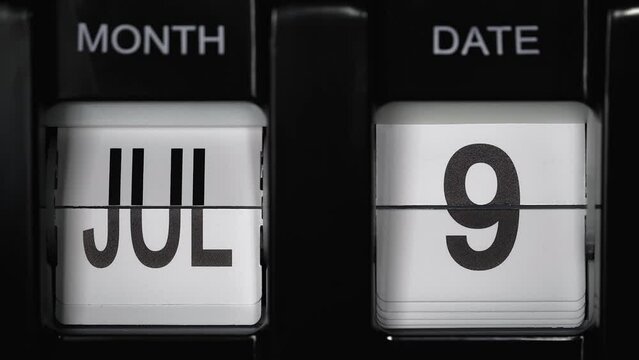 retro flip calendar with a date change from the eighth of July to the ninth of July. daily calendar with a change of days of the month. close up.