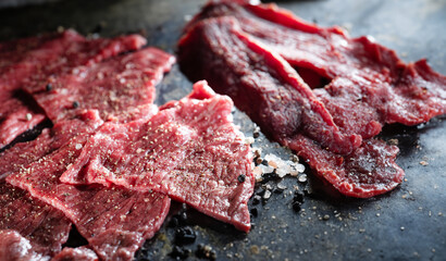 Thinly sliced beef and salt and pepper