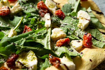 Salad pizza topped with various vegetables