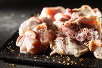 Raw chicken seasoned with various spices	