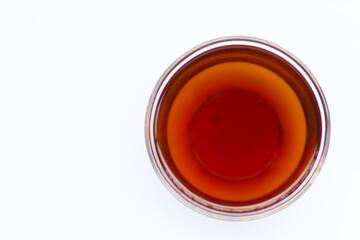 Fish sauce in bowl on white background.
