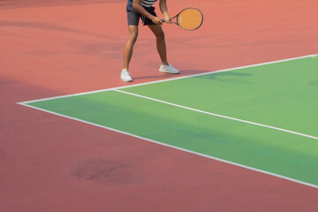 playing tennis on the court
