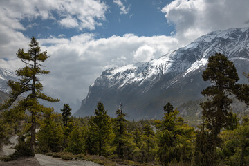 Snow covered mountains in the scenic Himalayan valley at Annapurna mountain range on the Annapurna circuit trail route