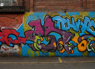 Vibrant Graffiti Brick Wall Art: Explore and Download High-Quality Images on Adobe Stock