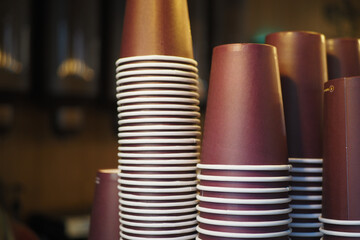 Lots of paper coffee cups at cafe 