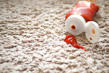Tomato stain on a carpet indoors, - obrazy, fototapety, plakaty