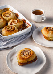 Cinnamon rolls airy breakfast with coffee and tea 
