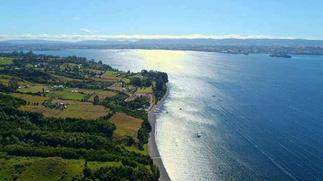 Aerial view of Pisciculture and beaches on the coast of Lemuy island, Chile