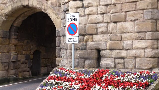British Flag Made Of Flowers by Road and Gate to Alnwick Medieval Town, England UK