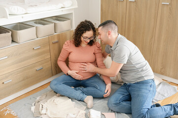 Two future parents awaiting the baby happily