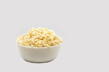 Puffed Rice or Popped Rice in a White Bowl Isolated on White Background with Copy Space for Texts Writing, Indian Snack Food
