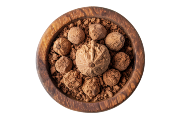 
Ground nutmeg in wooden bowl top view Spice isolated on white background Real daytime first person perspective