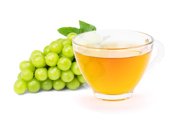 Green grape and cup of herbal tea isolated on white background.