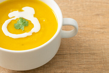 pumpkin soup in white bowl