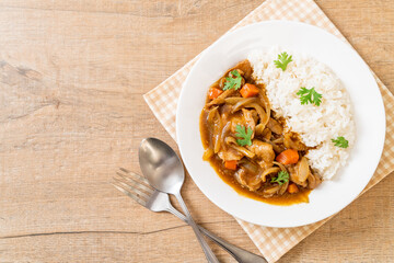 Japanese curry rice with sliced pork, carrot and onions