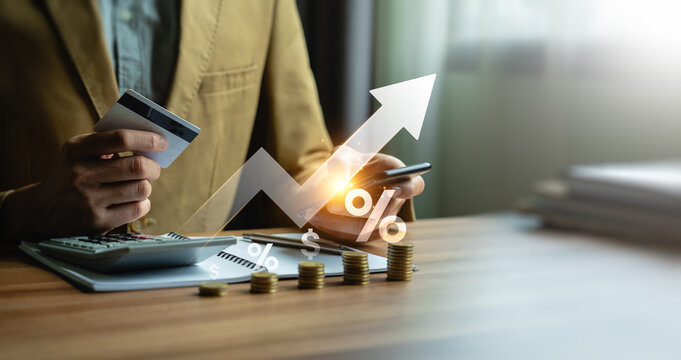 Businessman calculates credit card interest, special offer of shopping department store and discount. Interest rate, installment payment, promotion, marketing, boost sales, Economic recession, Payment