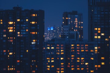 Aerial View of a City at Night From the Roof of a Skyscraper, A skyline at night with only few lit windows, AI Generated