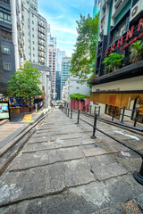 Fototapeta na wymiar Road street view of Stone Slabs Street paved by granite stone steps in Pottinger Street old town Central, Hong Kong 
