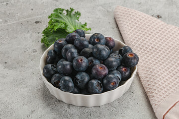Sweet ripe blueberry on the bowl