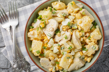 Festive Chicken salad with fresh pineapple, corn, cheese, eggs and onions dressed with mayonnaise...