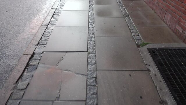 POV, walking down the sidewalk.